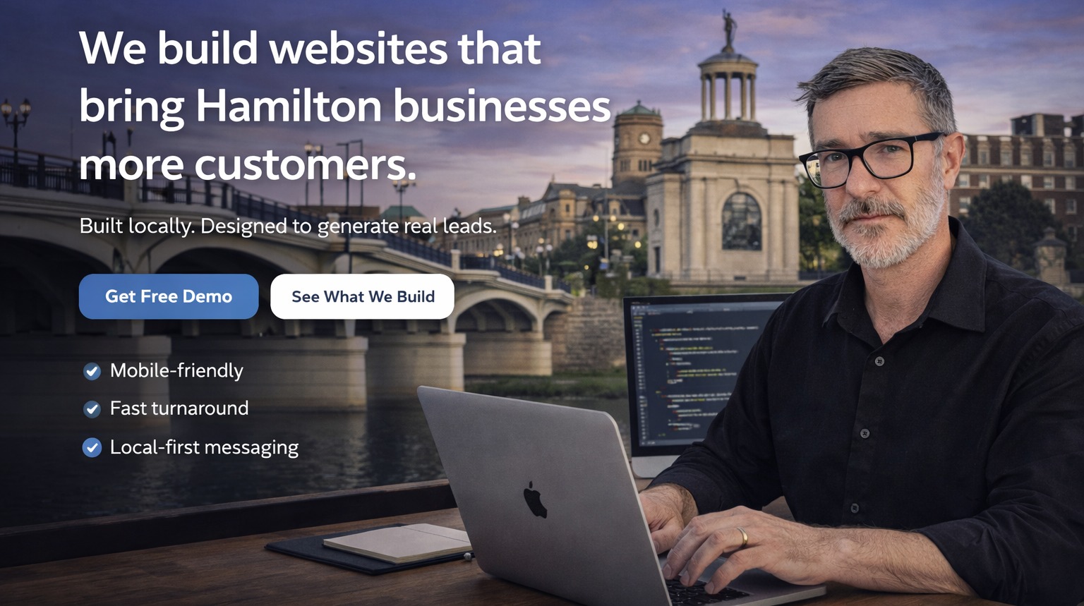 Hamilton Web Co hero showing Hamilton skyline and founder working at a laptop